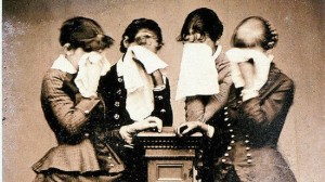 Women weeping into handkerchiefs